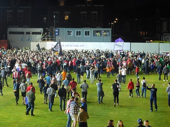 Fan on the pitch after the final whistle in the Exeter Lincol play off semi final